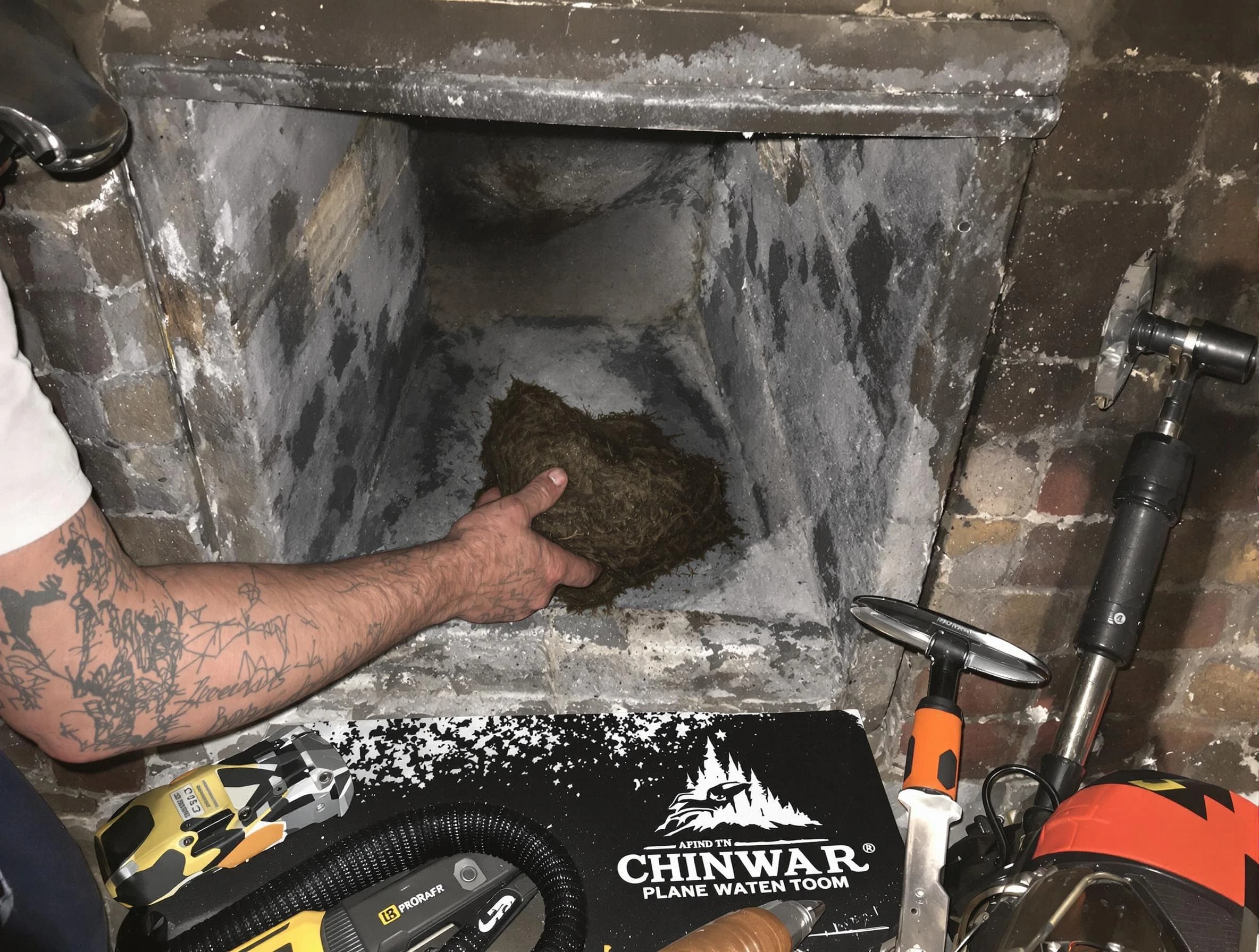Washington Chimney Sweep safely removing debris and screening chimney in Washington, PA